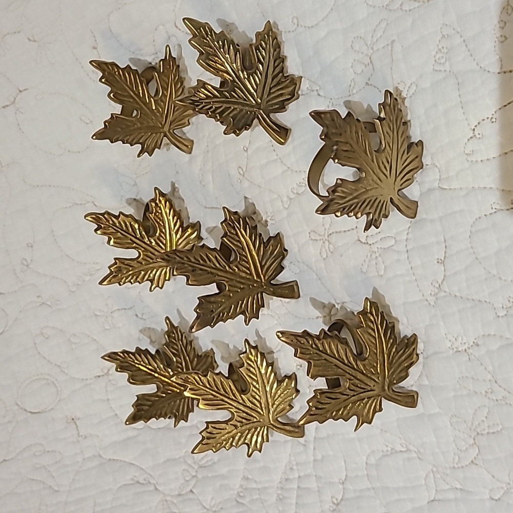Maple brass napkin set of eight.
